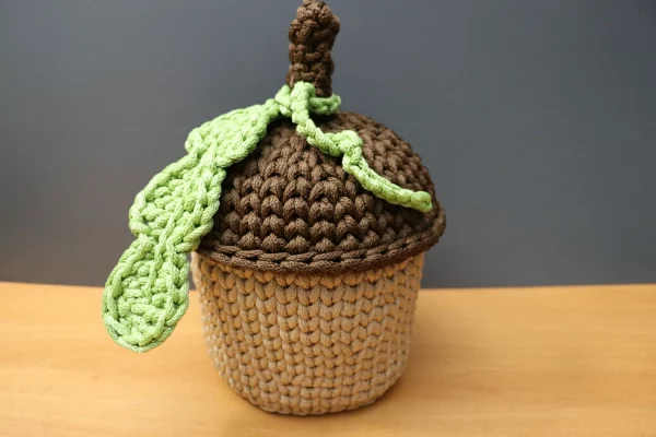 Handmade crochet acorn-shaped basket